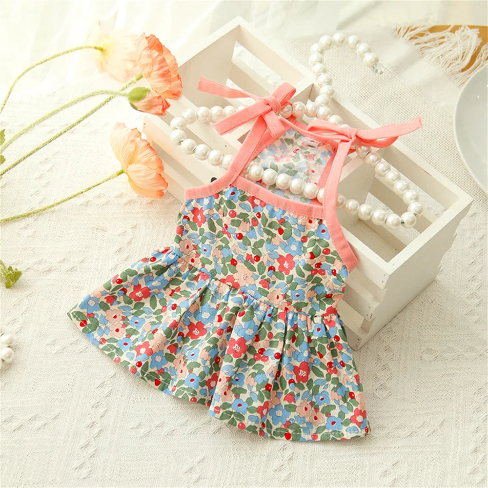 The Summer Cotton Cat Dress by KittyNook Cat Co. features pink florals and pearls for breezy, stylish comfort.