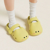 Thumbnail for Person wearing KittyNook Cat Co. Adorable Cat Face Comfort Sandals with white socks on a textured floor.