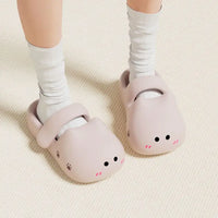 Thumbnail for Person wearing KittyNook Cat Co. Adorable Cat Face Comfort Sandals with white socks on a light textured floor.