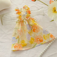 Thumbnail for KittyNook Cat Co.'s Summer Cotton Cat Dress features floral ruffles and pastel hues, shown on a glass bottle.