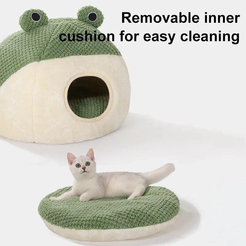 a cat showing that the cushion is removable in theHoppin Haven Cool Cat Bed in Full Cave Variant. the text in the photo says removable inner cushion for easy cleaning