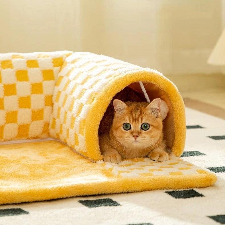 Close up of a cat inside the Purr Plaid Cat Toy Tunnel Hideaway