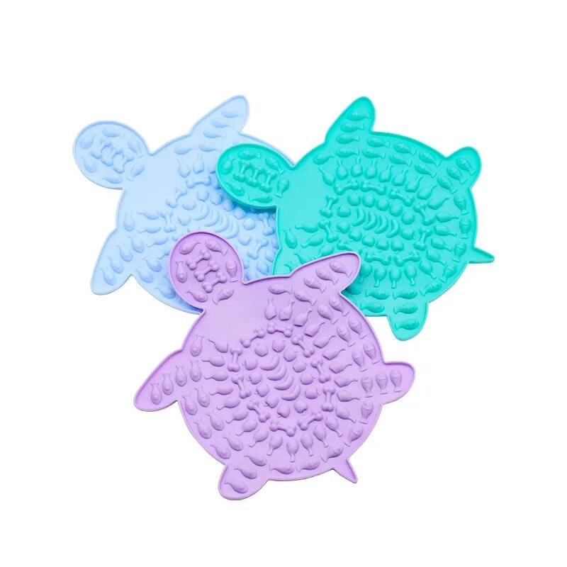 Turtle Treats Silicone Lick Mat in cyan, periwinkle, and lilac