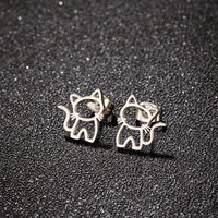 Thumbnail for KittyShine Stainless Steel Ear Studs by KittyNook Cat Co. are cute cat-shaped earrings on a textured black background.