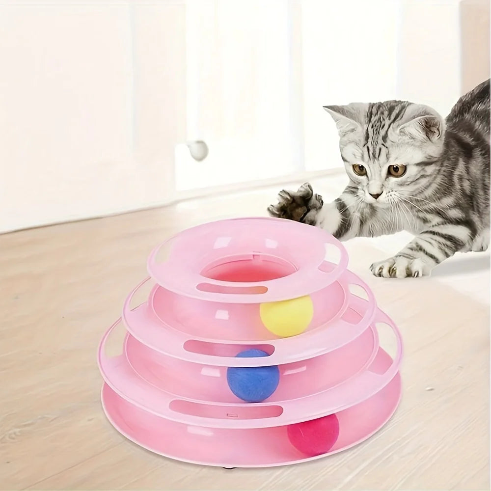 Gray kitten plays with KittyNook Cat Co.’s 3-Layer Interactive Cat Toy Tower on a light wood floor near a window.