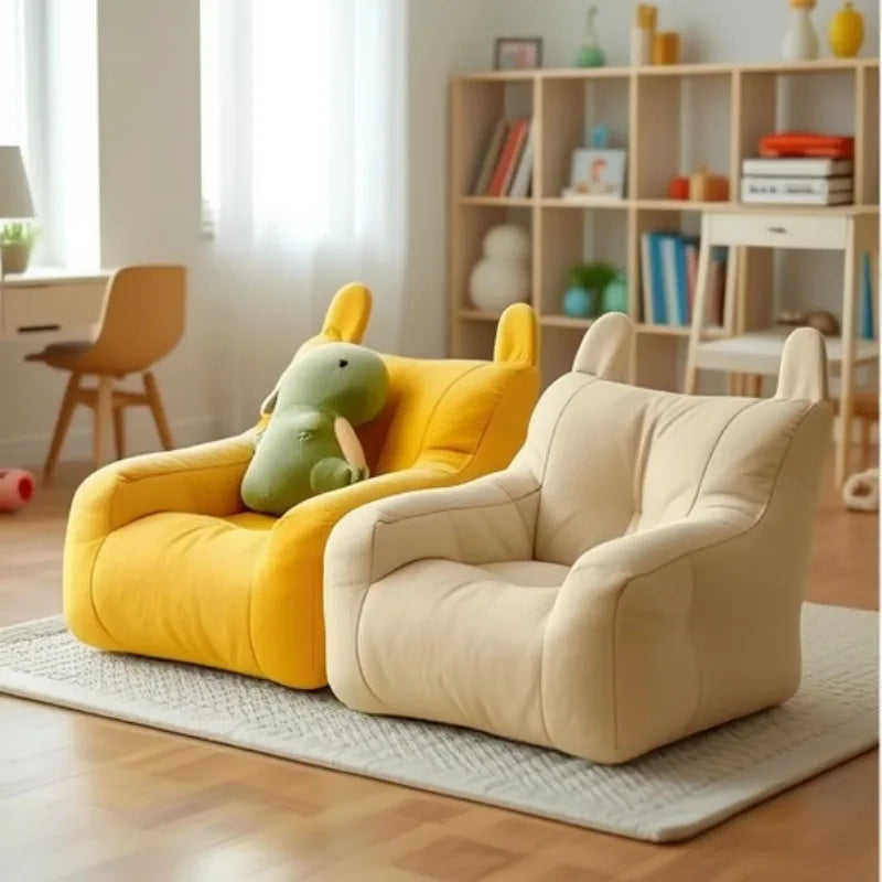 Two Cat Cartoon Sofa Beds by KittyNook Cat Co. add charm to a cozy, well-lit room with a rug and bookshelf.