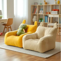 Thumbnail for Two Cat Cartoon Sofa Beds by KittyNook Cat Co. add charm to a cozy, well-lit room with a rug and bookshelf.