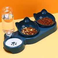 Thumbnail for KittyNook Cat Co. Cute 3 In 1 Cats Bowls With Water Feeder and paw-print dish on a yellow surface.