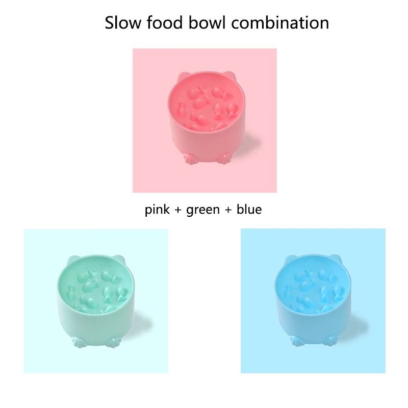 Three KittyNook Elevated Anti-Choke Slow Feeder Bowls in pink, green, and blue are arranged on matching backgrounds.