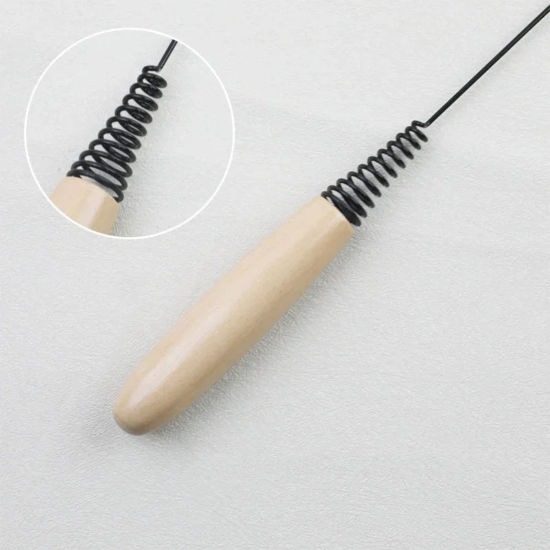 KittyNook Cat Co.’s Eco-Friendly Wood & Feather Cat Teaser features a black wired handle, shown on a white background.