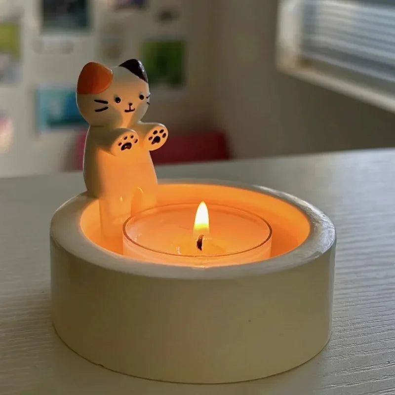 A small candle glows in the KittyNook Cat Co. Cute Kitten Candle Holder—adorable decor and a charming mood booster.