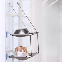 Thumbnail for Two cats relax on the KittyNook Cat Co. Space-Saving Double Hanging Pet Bed, one above and one on the lower tier.