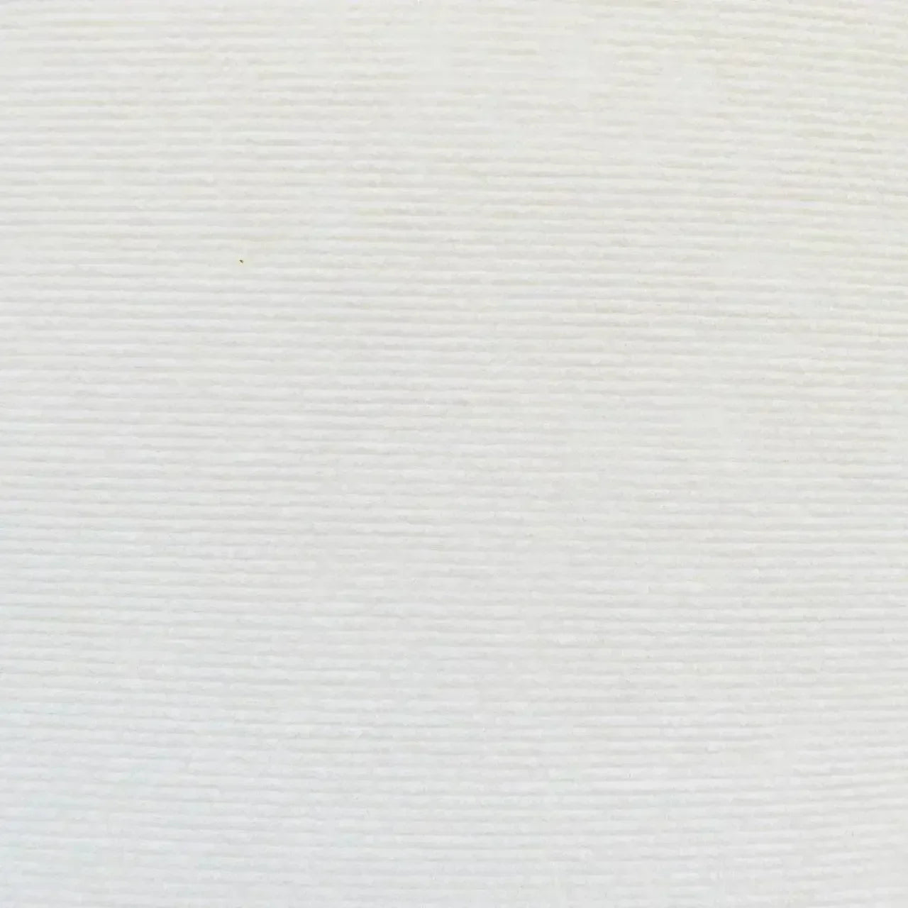 KittyNook Cat Co. Self-Adhesive Cat Scratching Board: white textured paper with subtle horizontal ridges for furniture.