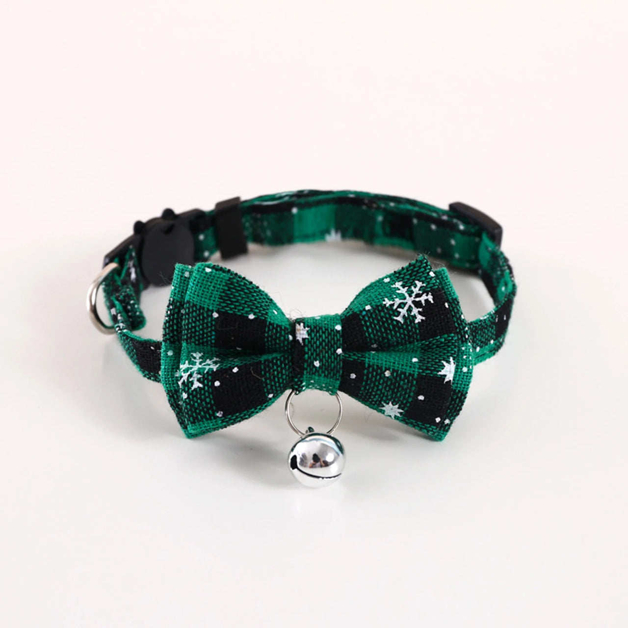 KittyNook Cat Co. Christmas Cat Bow Tie with Jingle Bell—green & black plaid with snowflakes and a silver bell.