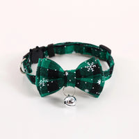 Thumbnail for KittyNook Cat Co. Christmas Cat Bow Tie with Jingle Bell—green & black plaid with snowflakes and a silver bell.