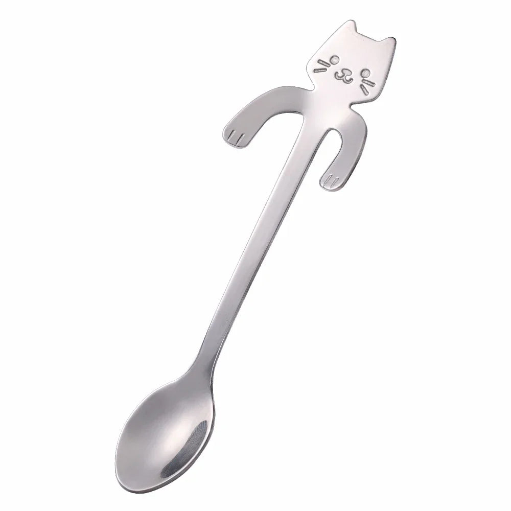 The KittyNook Cat Co. Cat Cling Stainless Steel Mug Spoon is a cute, cat-shaped handle spoon for your favorite mug.