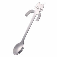 Thumbnail for The KittyNook Cat Co. Cat Cling Stainless Steel Mug Spoon is a cute, cat-shaped handle spoon for your favorite mug.