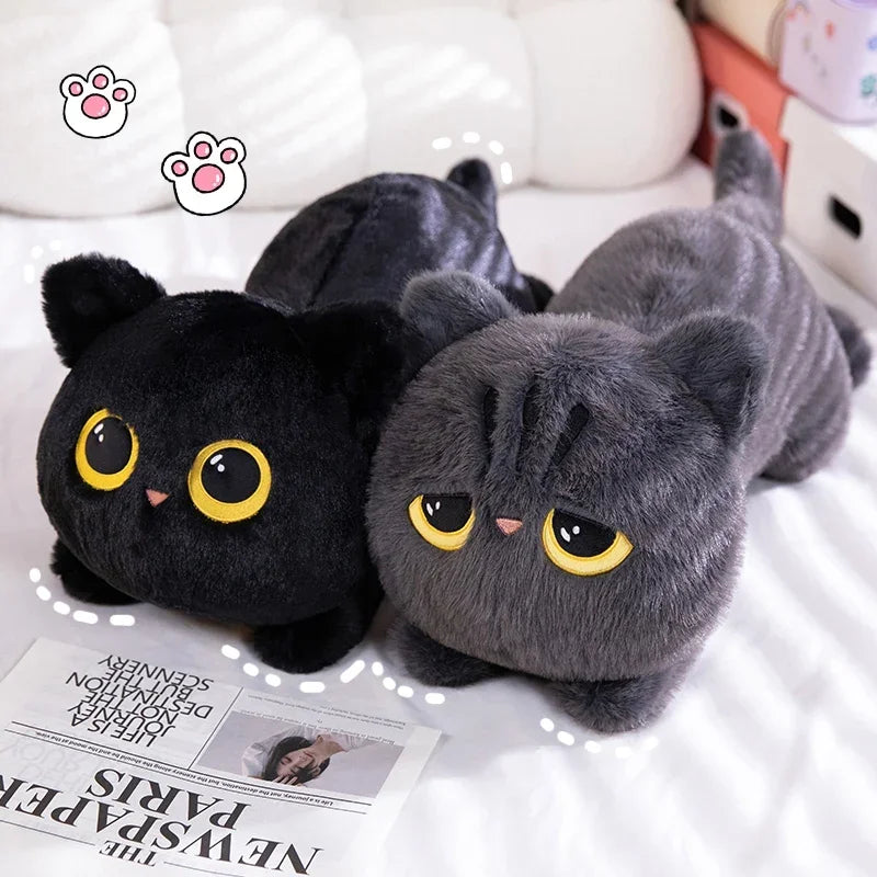 KittyNook Cat Co.’s Plush Cat Pillow: Whimsical Home Cozy—two yellow-eyed plushies, a perfect cat lover’s gift on any bed.