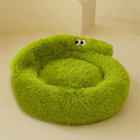 Thumbnail for The Warm & Soft Cat Sleeping Pod by KittyNook Cat Co. is a round, green bed with cartoon eyes on cream background.