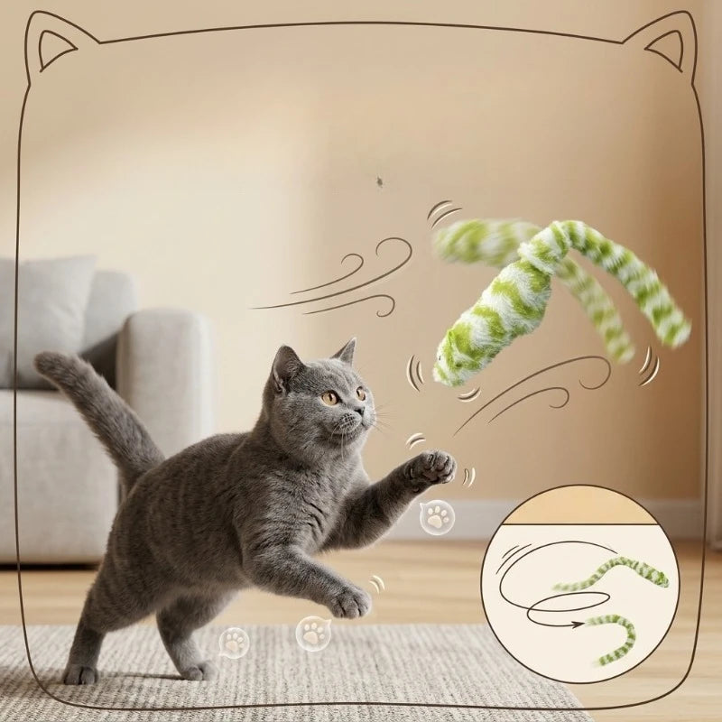 Gray cat leaps after KittyNook Cat Co.’s Interactive Mouse Chase Toy; beige couch in the background.