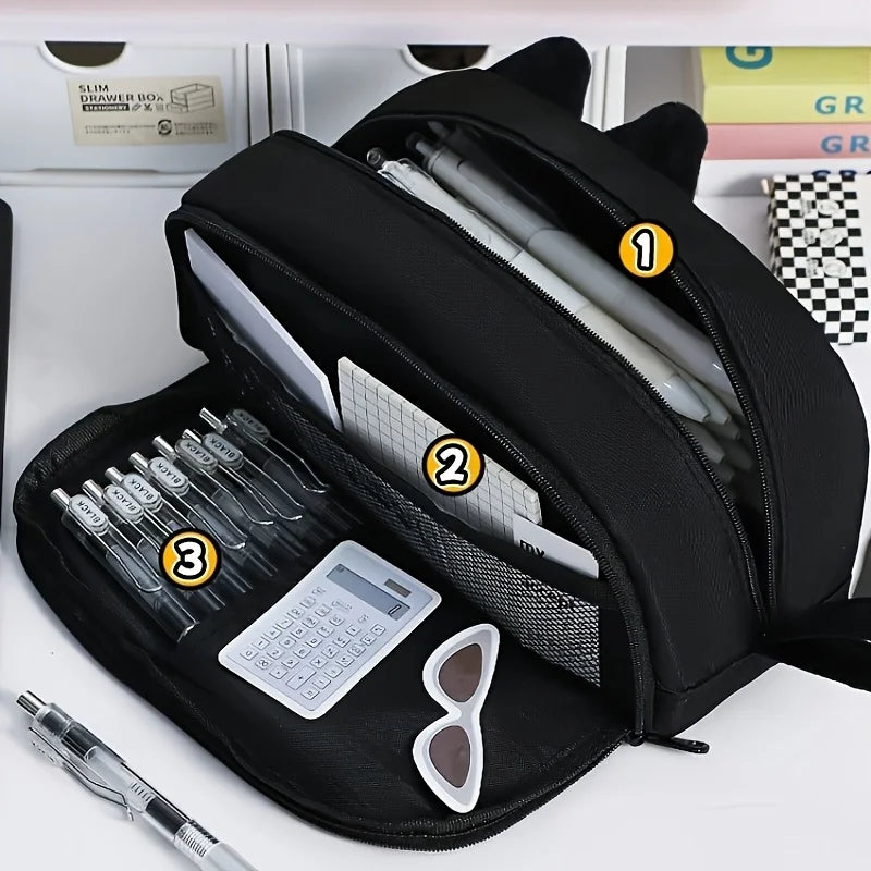 The Adorable 3D Cat Pencil Case by KittyNook Cat Co. opens to reveal pens, a ruler, notepad, calculator, and sunglasses.