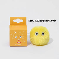 Thumbnail for KittyNook Cat Co. Interactive Cat Smart Ball Toy: small, yellow, fluffy with eyes, near orange box with cartoon face.