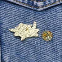 Thumbnail for The KittyNook Cat Co. Cute Black Cat Enamel Brooch and its backing sit on blue denim with visible stitching.