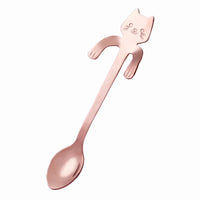 Thumbnail for KittyNook Cat Co.'s Cat Cling Stainless Steel Mug Spoon features a rose gold finish and cute whiskers and paws on the handle.