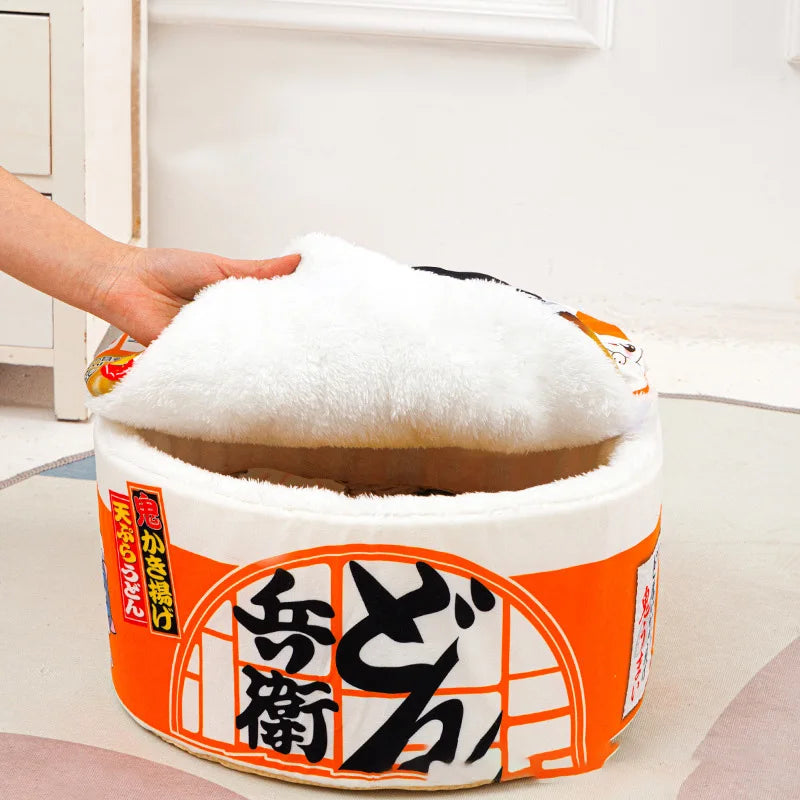 A hand lifts the lid of KittyNook's Instant Noodles Cat Bed, revealing its premium comfort interior.