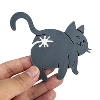 Thumbnail for A hand holds KittyNook Cat Co.’s Cat Butt Bread Clip, a cute gray food bag clip shaped like a winking cat.