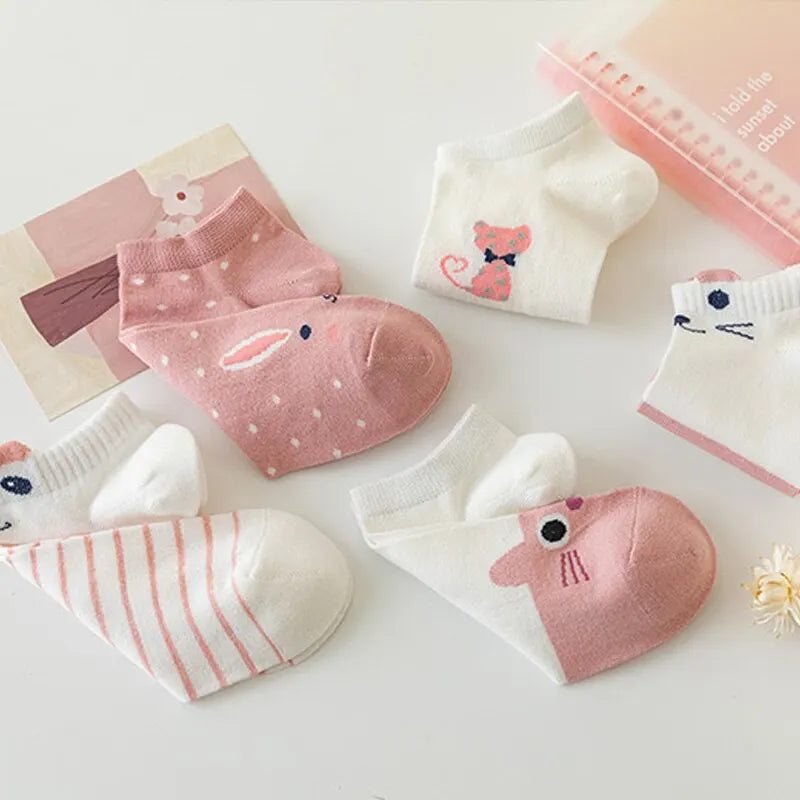 Five pairs of KittyNook Cat Co. Sweet Kitty Pink Short Tube Socks in white and pink, with cute accessories displayed.