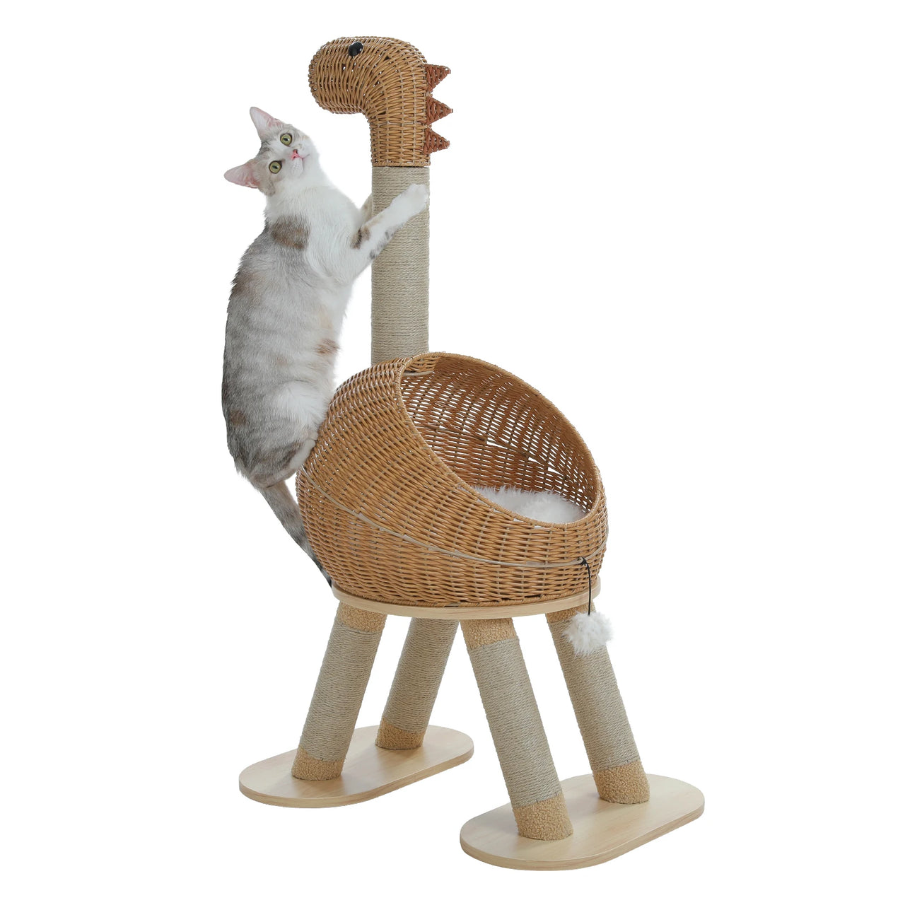 A cat climbs KittyNook’s Dinosaur Cat Tree Tower, a rattan condo with a basket body and four sturdy legs.