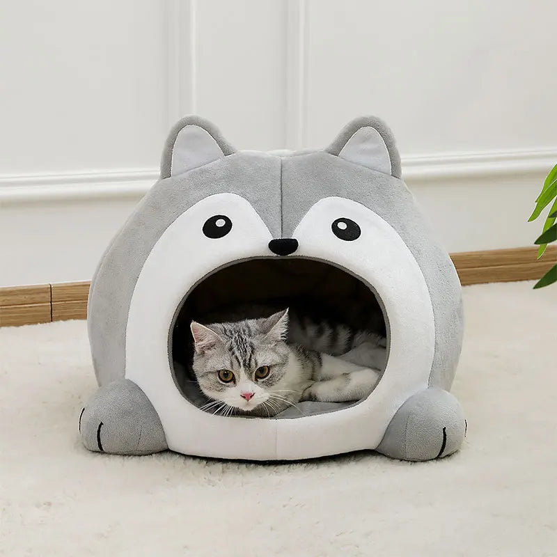 A cat lounges in the Fluffy Indoor Cat Cave Bed for Kittens by KittyNook Cat Co. on a cream carpet.