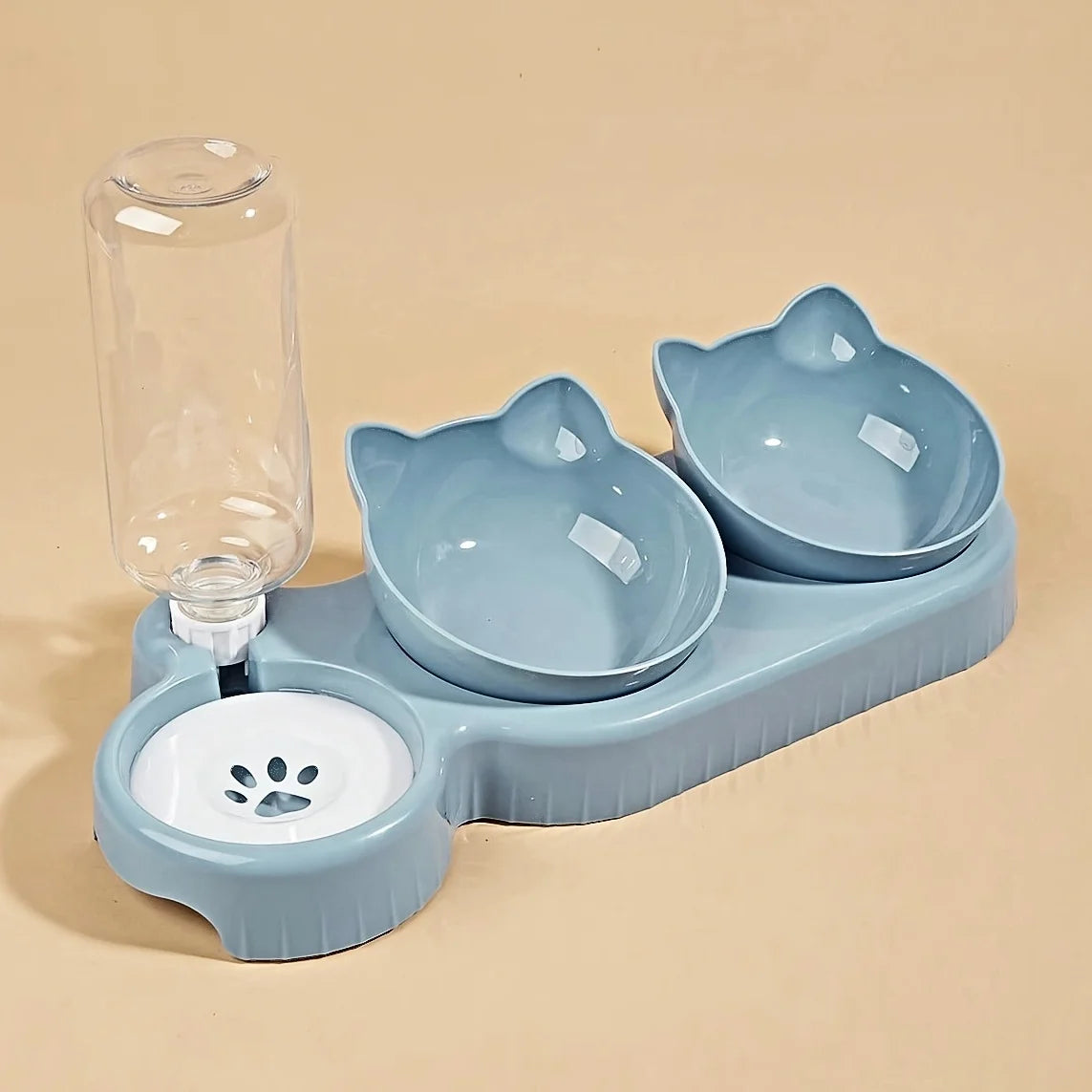 The KittyNook Cat Co. Cute 3 In 1 Cats Bowls With Water Feeder creates a cute feeding station on a beige background.