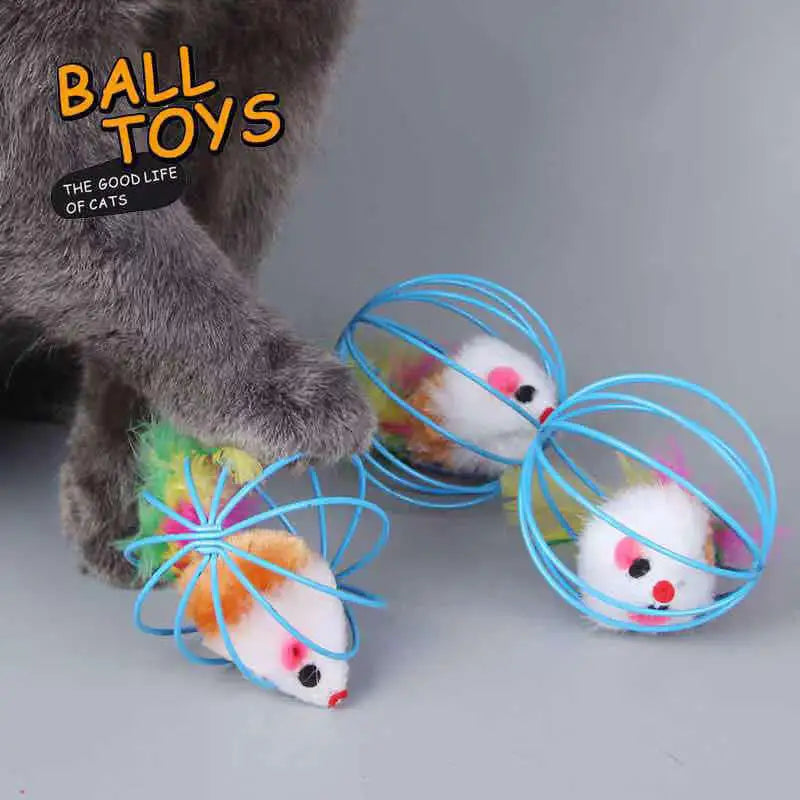 A cat plays with the KittyNook Cat Co. Interactive Sand-Chase Mouse Cat Toy inside blue wire balls on a gray surface.