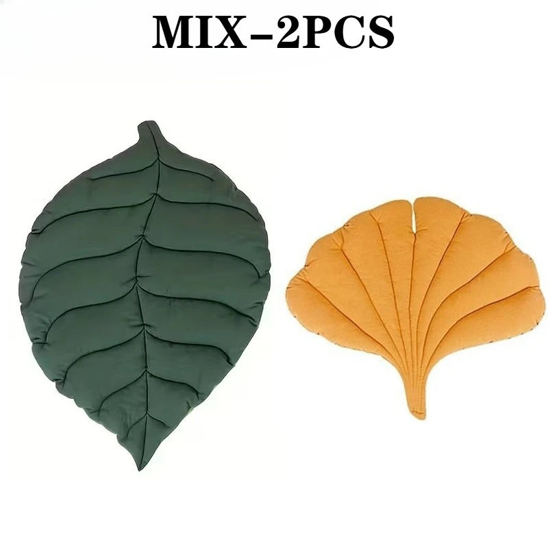 Two green and yellow leaf-shaped Leaf Pattern Cat Sleeping Mat units.