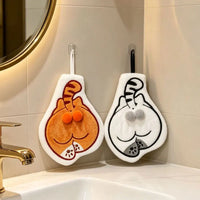 Thumbnail for Two orange and white Cartoon Cat Hanging Hand Towels suspended on a bathroom wall.