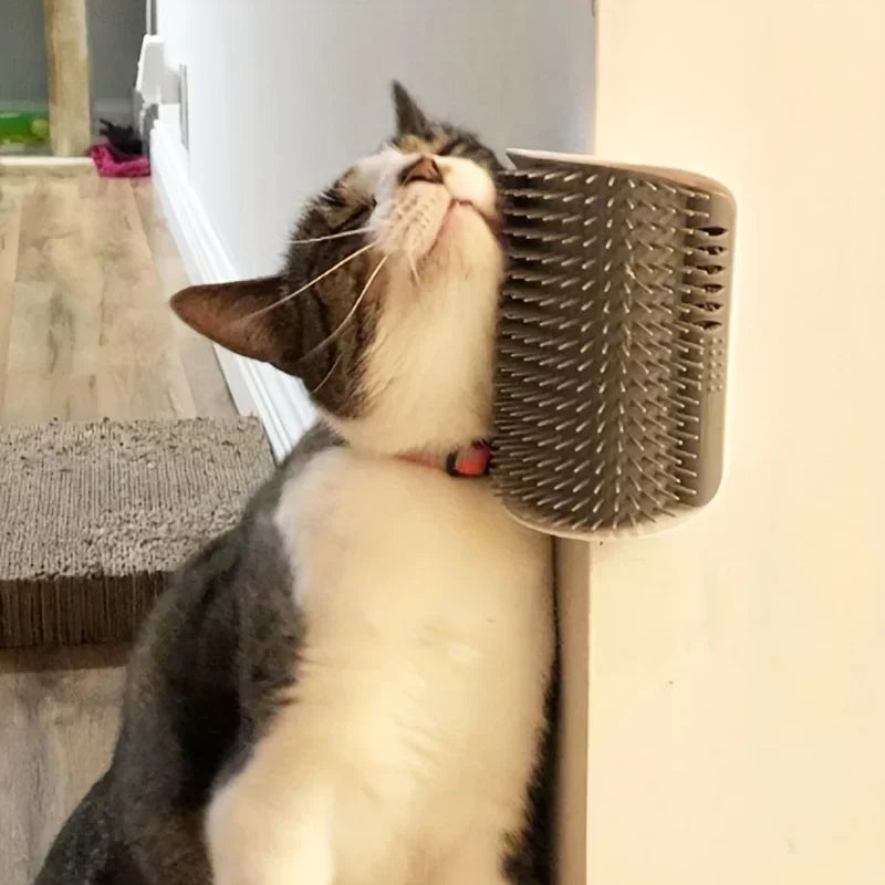 A cat uses the KittyNook Cat Co. Ultimate Corner Arch Self-Groomer, looking relaxed and content.