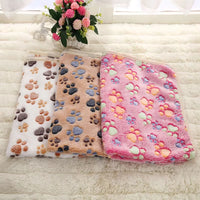 Thumbnail for Three SnugglePaws Luxe Fleece Pet Blankets by KittyNook Cat Co. with paw prints are displayed on a plush surface.