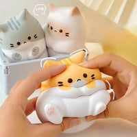 Thumbnail for Hands squish a KittyNook Cat Co. Cat Squeeze Ball; two more stress toys are in a box behind it.