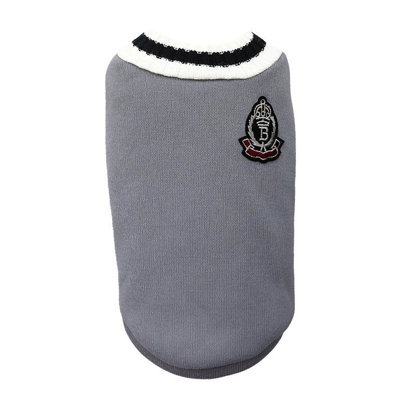 The KittyNook Cat Co. Cozy Fluff Cat Sweater features a black and white collar and an embroidered crest patch.