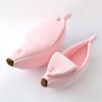 Thumbnail for Two pink Cute Funny Banana Shape Cat Beds by KittyNook Cat Co. with brown tips, shown on a white surface.