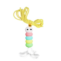 Thumbnail for Elevate Playtime by KittyNook Cat Co.: Interactive hanging toy with beads, googly eyes, yellow string, and white feather.