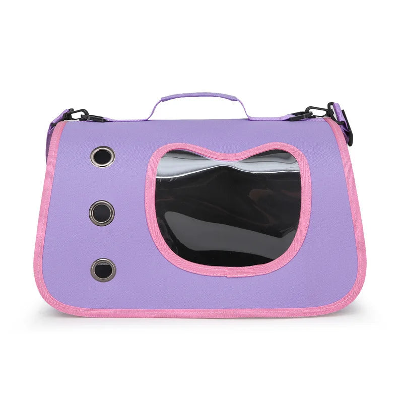 KittyNook Cat Co. Premium Foldable Small Cat Carrying Bag in purple with pink trim, clear window, and ventilation holes.