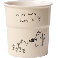 Thumbnail for KittyNook Cat Co.’s Cute Illustrated Ceramic Cat Mug features a cat watering flowers and 