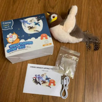 Thumbnail for KittyNook Cat Co. Squeaky Plush Cat Toy set: toy, USB cable, user guide & parts bag displayed on a wooden floor.