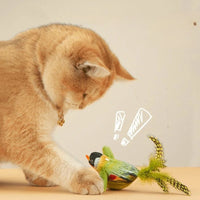 Thumbnail for A cat paws at the KittyNook Cat Co. Ultimate Interactive Chirping Bird Cat Toy, adding indoor enrichment fun.