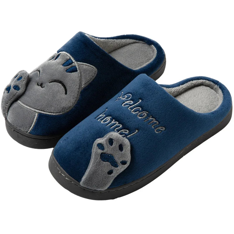 KittyNook Cat Co. Happy Pawprints Lucky Cat Slippers—blue with paw prints and "Welcome home!" text for cozy comfort.