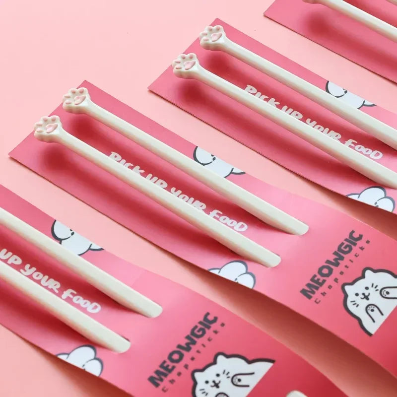 Little Paws Silicone Training Chopsticks for Kids by KittyNook Cat Co.—fun cat paw design, perfect for learning to eat!.
