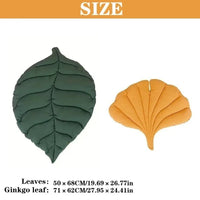 Thumbnail for A reversible KittyNook Cat Co. Leaf Pattern Cat Sleeping Mat featuring a green ovate leaf and a yellow ginkgo leaf.
